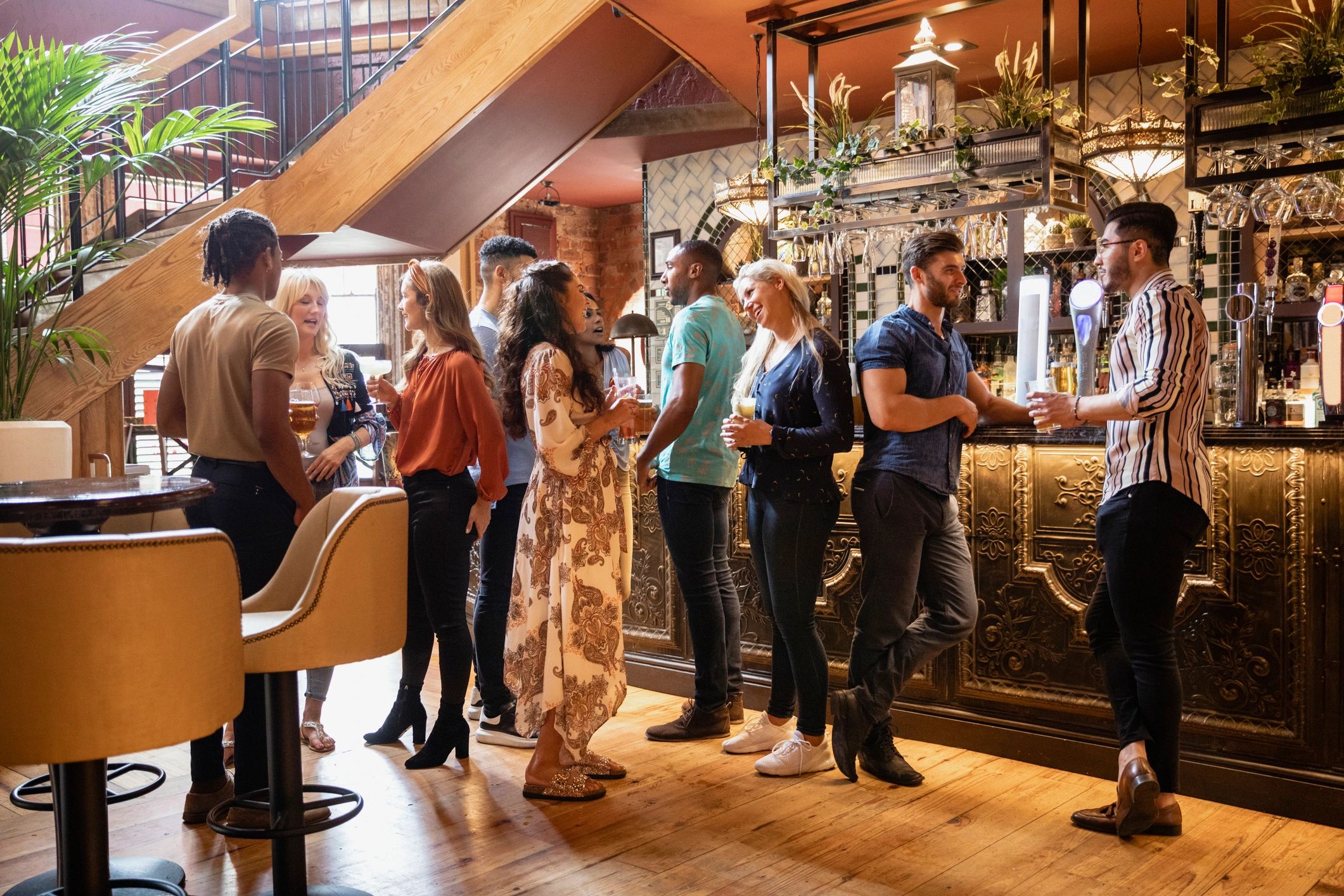 Friends enjoying drinks at a stylish bar