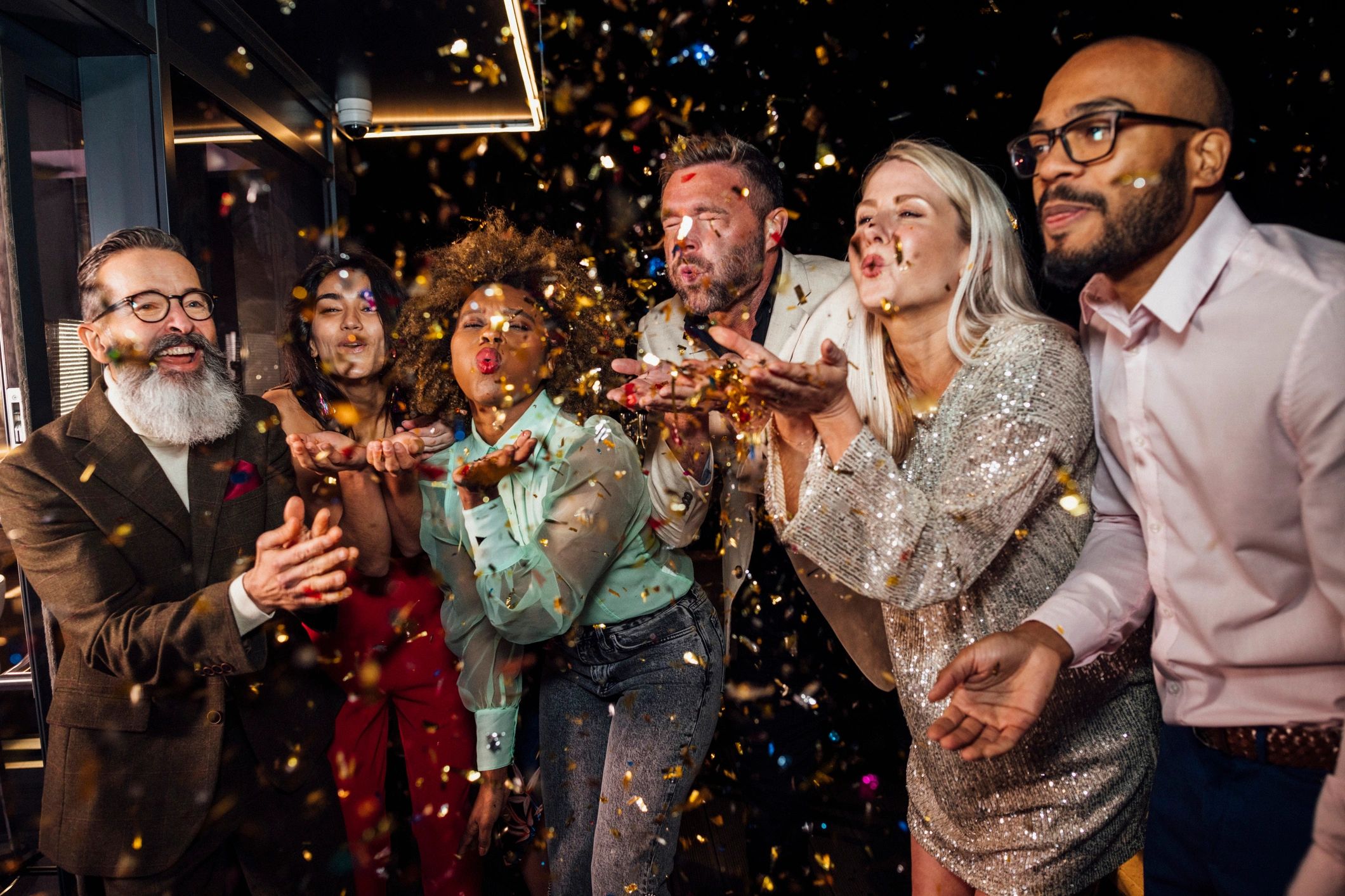 Nightlife celebration with confetti and group energy