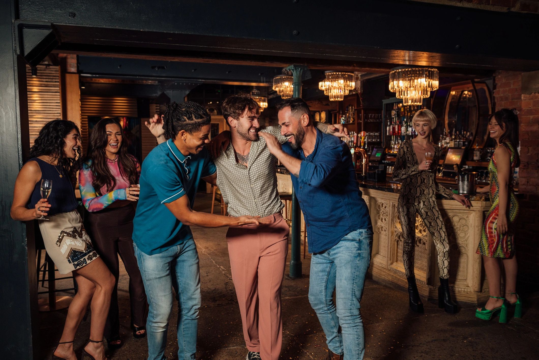Friends celebrating together in a nightlife venue