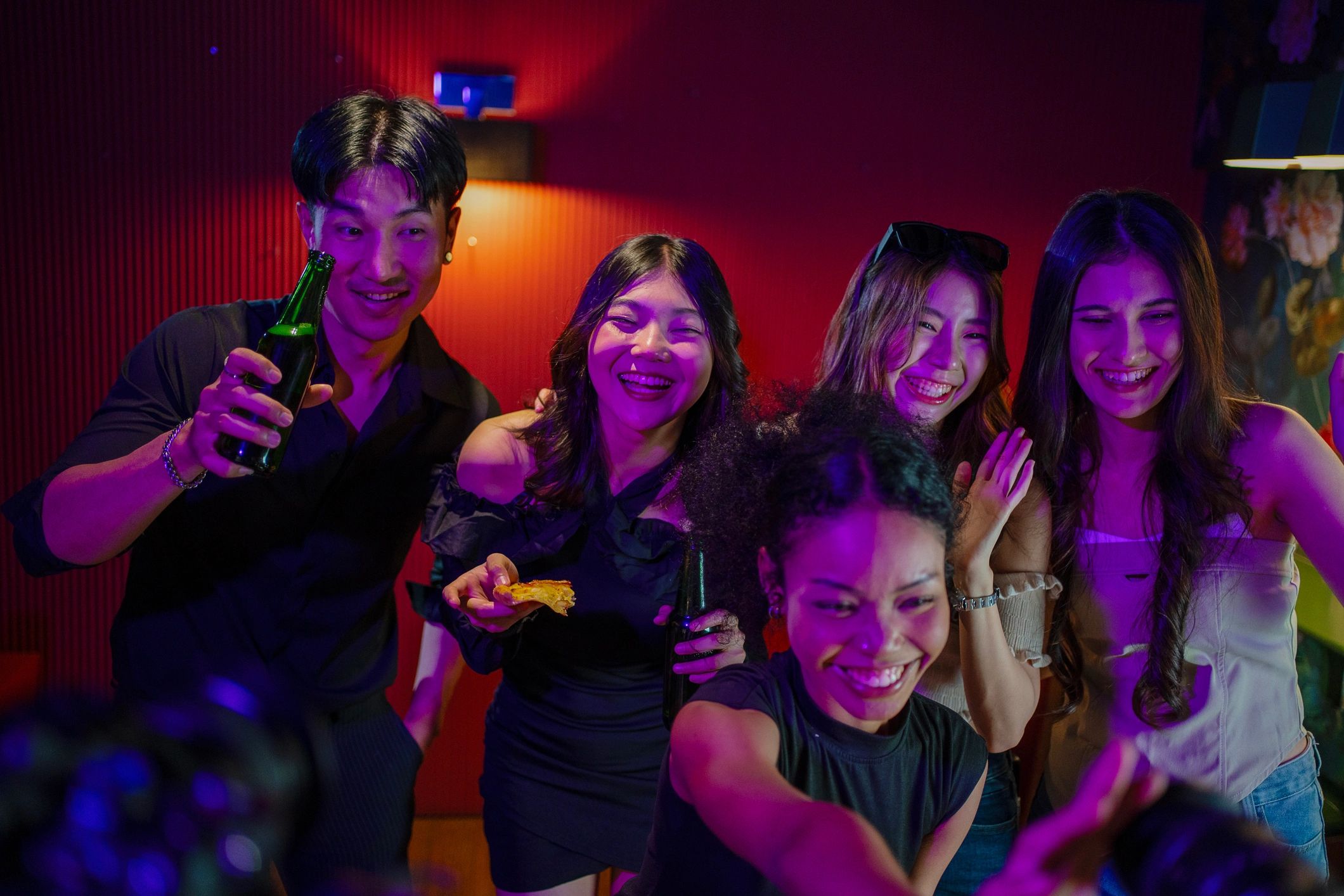 Friends celebrating together in a luxury club setting